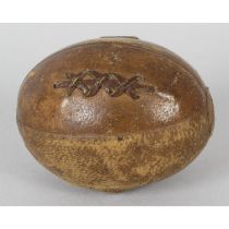 A novelty 'rugby ball' travelling inkwell.