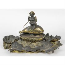 A gilt bronze cowrie shell inkstand.