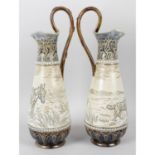 A pair of Royal Doulton ewers by Hannah Barlow