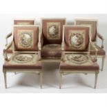 A set of eight carved, painted and gilded wooden framed chairs.