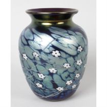 An iridescent glass vase.