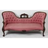 A Victorian conversation sofa