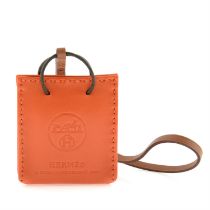 Hermès - Feu Milo Swift Orange bag charm.