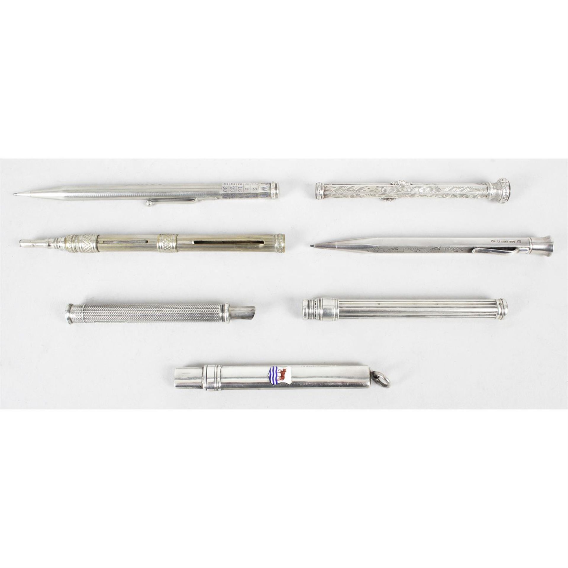Seven assorted writing implements