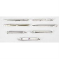 Seven assorted writing implements