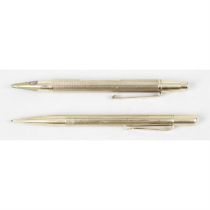 Two 9ct gold propelling pencils