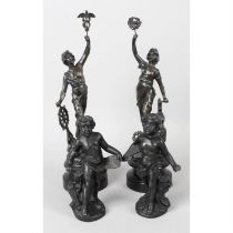 A group of five assorted spelter figurines.