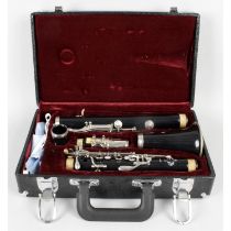 Three cased clarinets