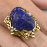 Lapis lazuli ring with diamond scrolling surround