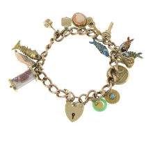 Mid 20th century 9ct gold charm bracelet, suspending fourteen charms