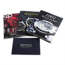 A group of eight watch related magazines and books.