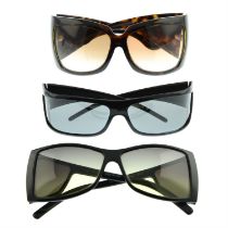 Gucci - three pairs of sunglasses.