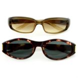 Gucci - two pairs of sunglasses.