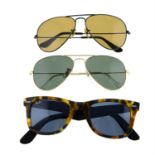 Ray-Ban - three pairs of sunglasses.