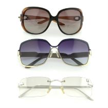 Christian Dior - three pairs of sunglasses.