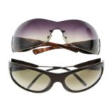 Prada - two pairs of sunglasses.