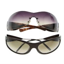 Prada - two pairs of sunglasses.