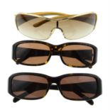 Prada - three pairs of sunglasses.