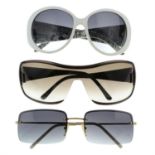 Gucci - three pairs of sunglasses.