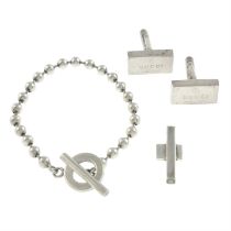 Gucci - silver bracelet, pendant, and cufflinks.