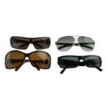 Prada - four pairs of sunglasses.
