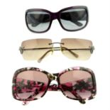 Versace - three pairs of sunglasses.