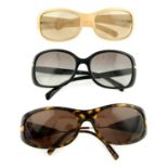 Prada - three pairs of sunglasses.