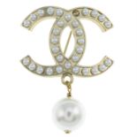Chanel - CC imitation pearl brooch.