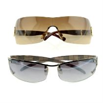 Burberry - two pairs of sunglasses.