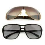 Prada - two pairs of sunglasses.