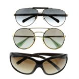 Prada - three pairs of sunglasses.