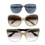 Prada - three pairs of sunglasses.