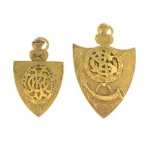 Two early 20th century gold shield medal pendants.