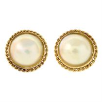 A pair of mabe pearl stud earrings.