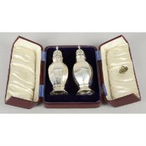 Cased pair of Edwardian silver sugar casters.