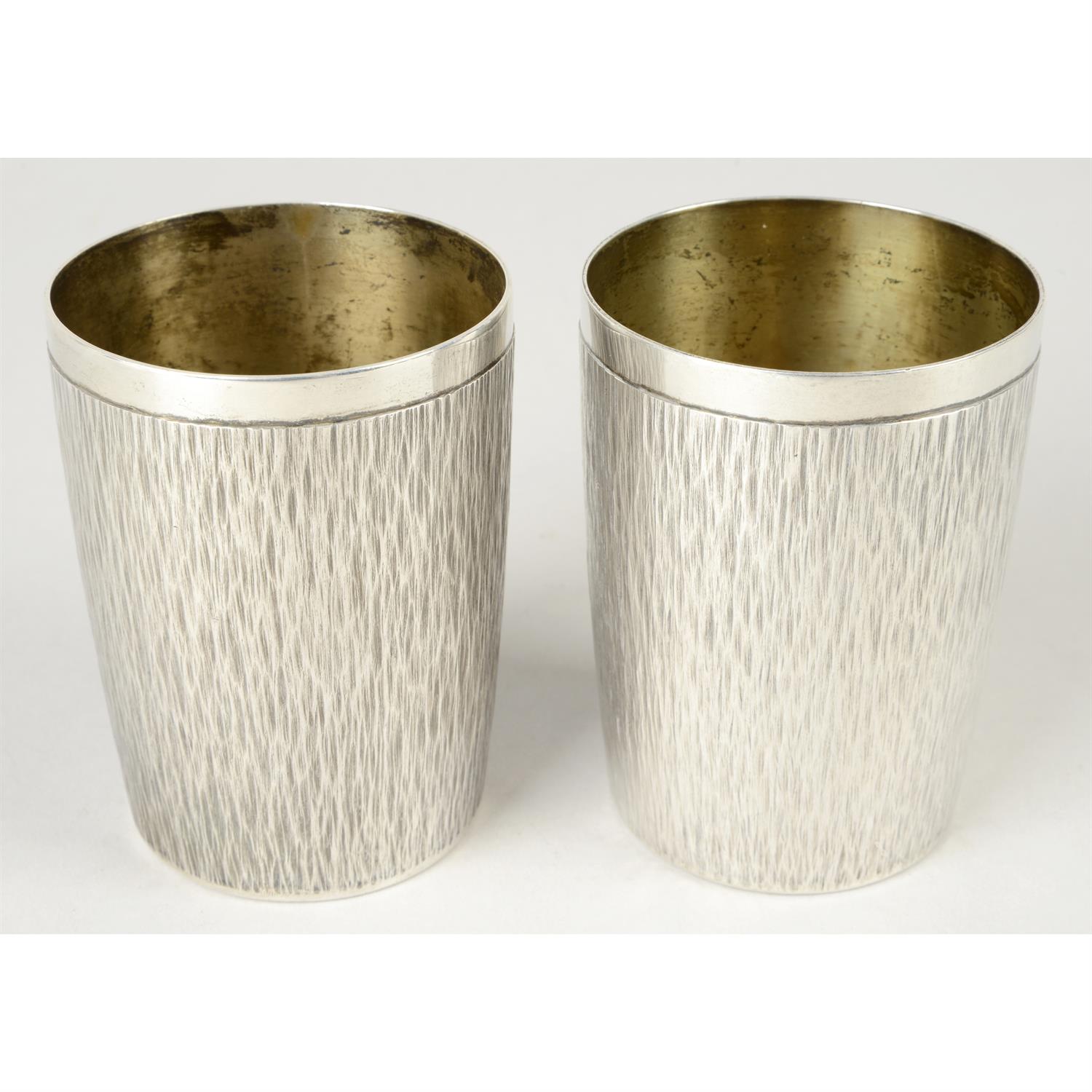 Pair of Gerald Benney silver tumbler cups.