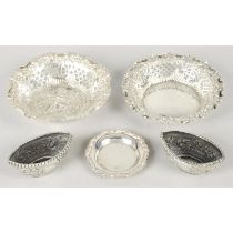 A selection of small silver items to include trinket dishes, tea strainer, open salts, etc.