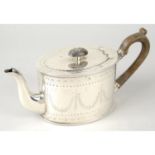 A Victorian silver teapot.