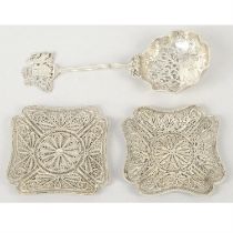 Danish silver pierced spoon; plus a pair of filigree dishes.
