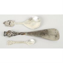 Silver caddy spoon with ship terminal, plus a small Celtic motif spoon & a shoehorn. (3).