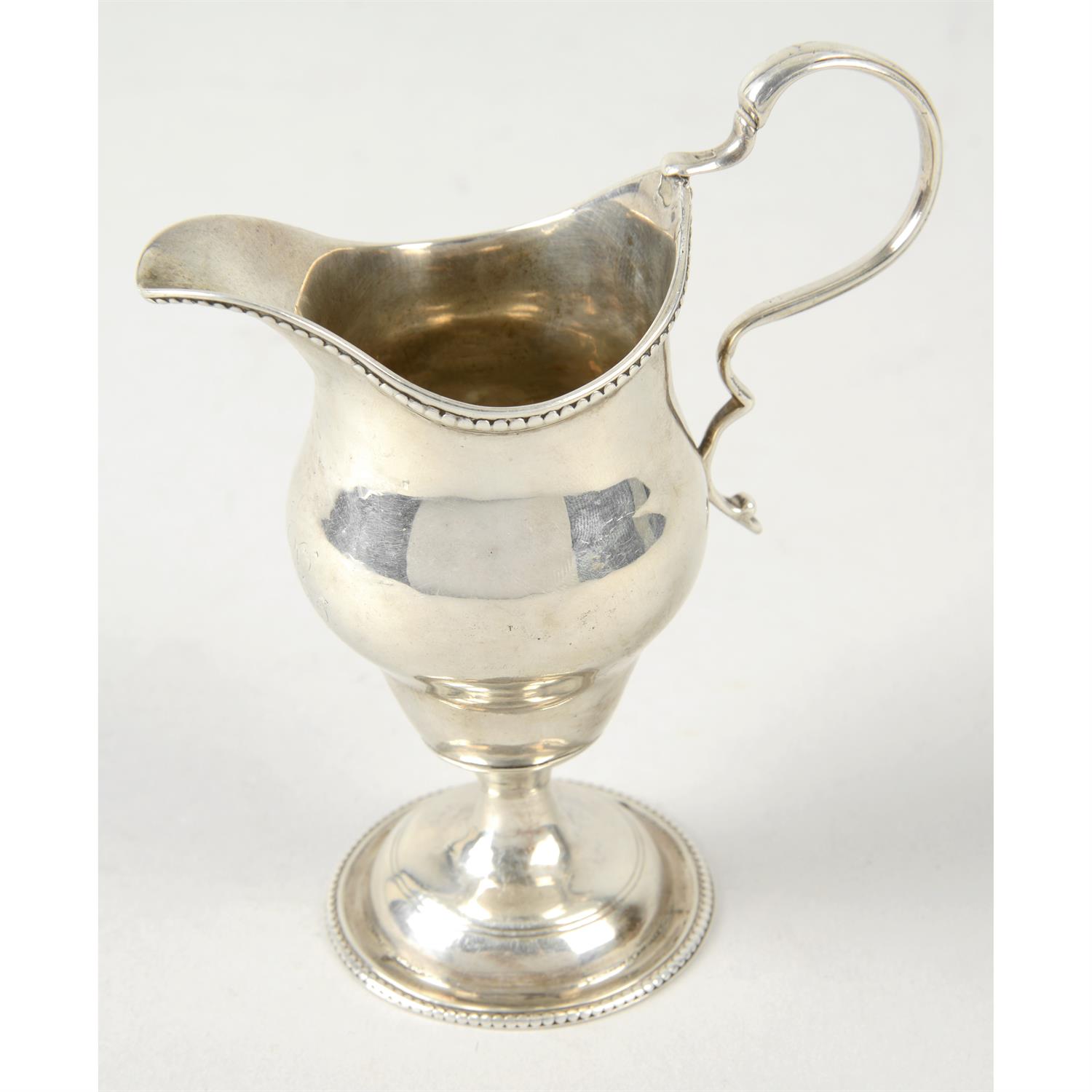 George III silver pedestal cream jug.
