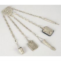 White metal chatelaine with accessories.