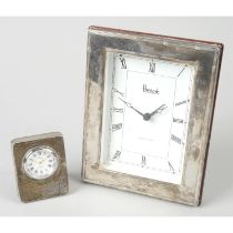 Modern silver mounted clock by Harrods; together with a miniature travel example. (2)