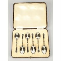 Cased set of mid-20th century silver & enamel coffee spoons.