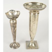 Two silver bud vases.