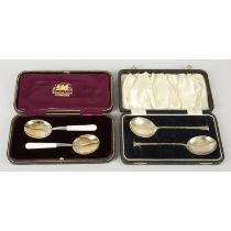 Two pairs of spoons, in fitted cases.