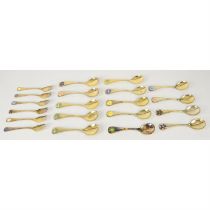 Georg Jensen, fourteen silver-gilt year spoons & six forks.