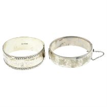 Two mid 20th century silver bangles.