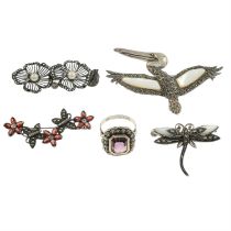 Four marcasite brooches, together with a amethyst and marcasite cluster ring