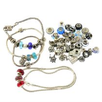 Three charm bracelets, a charm necklace & assorted charms, some by Chamila